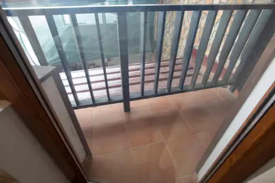 a view from the top of a balcony with a railing at Apartments in Complex Grand Manastira in Pamporovo