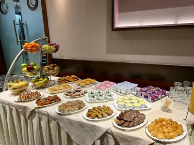 a table with many different types of food on it at Hotel Forum - Free Parking for cars in Sofia