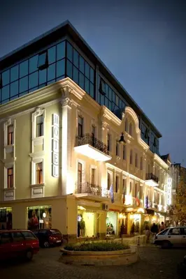 a large white building with a sign on it at Sveta Sofia Hotel in Sofia