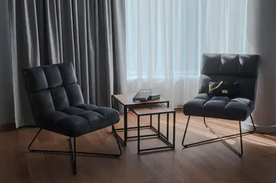 two chairs and a table in a room at Best Western Plus Lozenetz Hotel in Sofia