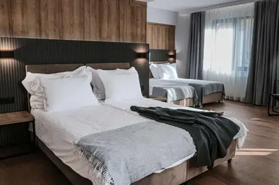 a hotel room with two beds in a bedroom at Best Western Plus Lozenetz Hotel in Sofia