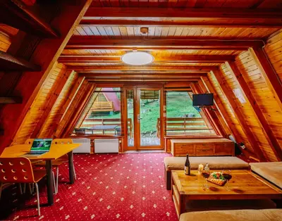 a room with a table and a laptop on a table at Complex Malina Pamporovo in Pamporovo