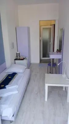 a hospital room with a bed and a table at Scotty's Boutique Hotel in Sofia