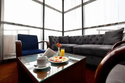 a living room with a couch and a coffee table at Art 'Otel in Sofia