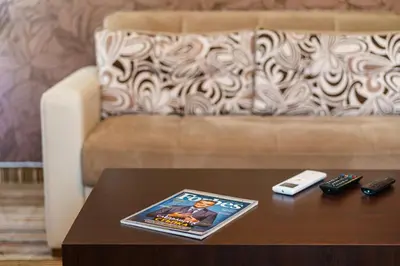 a living room with a couch and a coffee table at Hotel Avion - Self check in in Plovdiv