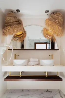 a bathroom with two sinks and a mirror at Oborishte 63,The Art Boutique Hotel by Sandglass in Sofia