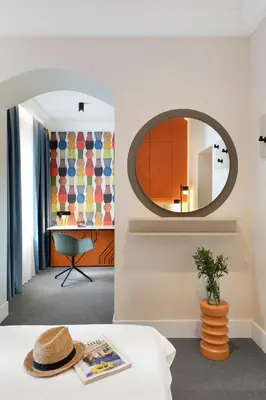 a room with a mirror and a table with a hat at Oborishte 63,The Art Boutique Hotel by Sandglass in Sofia