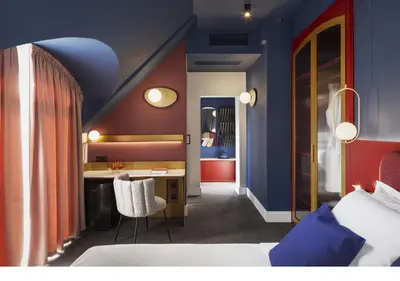 a room with a bed and a desk in a room at Oborishte 63,The Art Boutique Hotel by Sandglass in Sofia