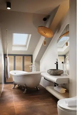 a bathroom with a white tub and a sink at Oborishte 63,The Art Boutique Hotel by Sandglass in Sofia