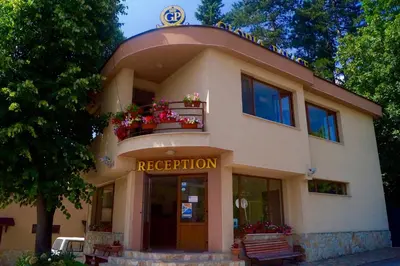 a building with a sign that reads reception at Hotel Gloria Palace Diplomat in Sofia