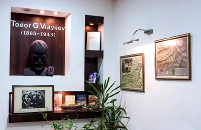 a museum display with pictures on a wall at DITER Family Hotel in Sofia