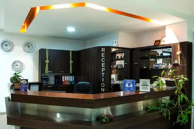 a reception area of a salon with a desk at DITER Family Hotel in Sofia
