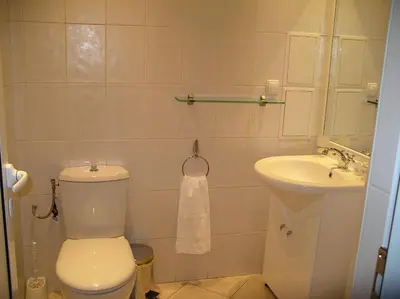 a bathroom with a toilet and a sink at Casa Ferrari Bed & Breakfast in Sofia
