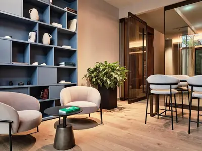 a salon with chairs and tables in a room at Crowne Plaza Sofia by IHG in Sofia