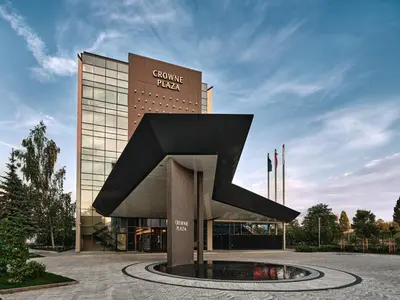 a building with a large letter k in front of it at Crowne Plaza Sofia by IHG in Sofia