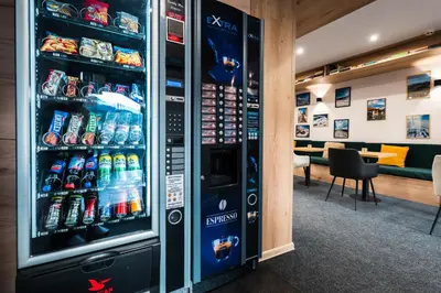 a refrigerator filled with lots of soda and sodas at Apart Hotel Dream in Bansko