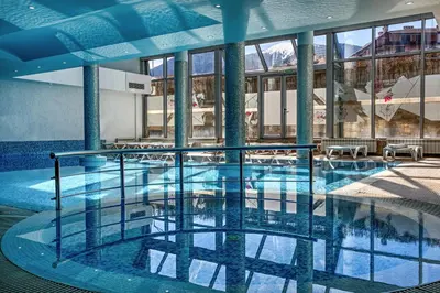 a large swimming pool in a large building at MPM Hotel Guinness in Bansko