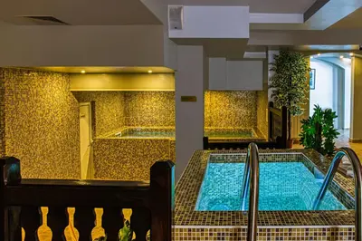 a swimming pool in a building with a spa at MPM Hotel Guinness in Bansko