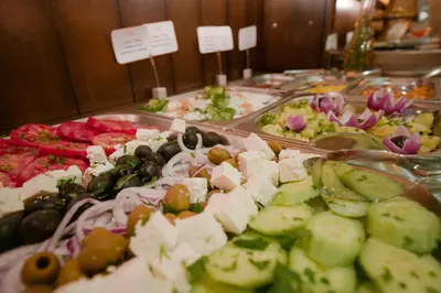 a buffet of different types of food on display at Apart Hotel Flora Residence Daisy in Borovets