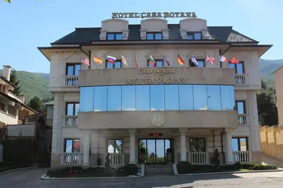 a building with flags on top of it at Casa Boyana Boutique Hotel in Sofia