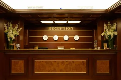 a reception desk in a hotel with a sign that reads reception at Casa Boyana Boutique Hotel in Sofia
