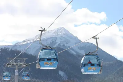 a ski lift with a mountain in the background at Mountain Paradise 2, One bedroom apartment in Bansko