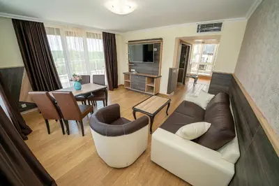a living room with a couch and a table at Hotel ZOO Sofia in Sofia