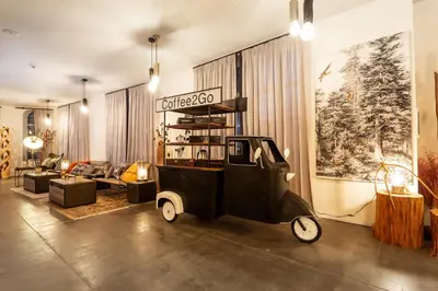 a living room with an old car in the middle at Villa Sokol in Borovets