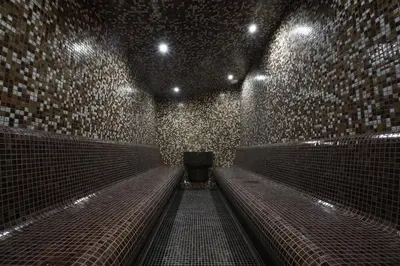 a dark room with a bench in a subway at Strimon Garden Medical SPA Hotel in Kyustendil