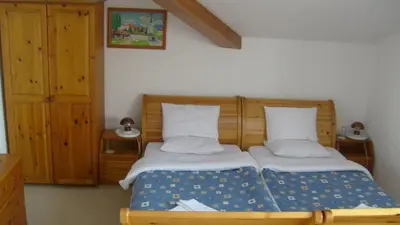 a bedroom with two beds in a room at Rahoff hotel in Bansko