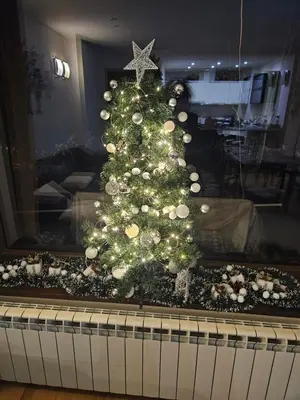 a christmas tree sitting on top of a piano at TERRA COMPLEX D4 - Private apartment - Golf, Skiing & SPA in Bansko