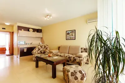 a living room with a couch and a table at Bright House in Plovdiv