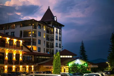 a large building with a clock tower on top of it at Grand Hotel Velingrad in Velingrad