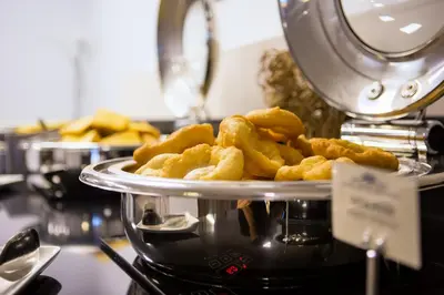 a pile of deep fried food in a machine at Grand Hotel Velingrad in Velingrad
