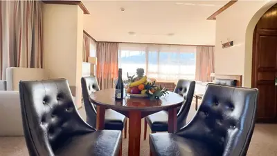 a dining room with a table with fruit on it at Platinum Hotel and Casino Bansko in Bansko