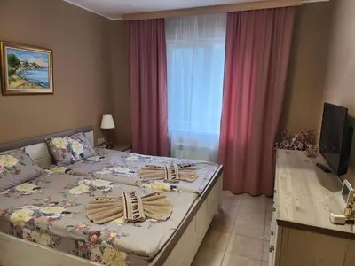 a hotel room with a bed with towels on it at Royal Plaza Apartments Borovets in Borovets