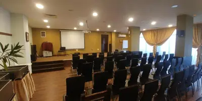 a conference room with chairs and a projection screen at Sunrise Park Hotel Bansko - Free Wellness in Bansko