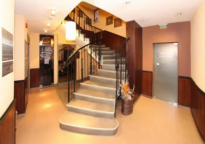 a hallway with a staircase in a building at Hotel Ego - Free Parking - Top Central Location in Plovdiv