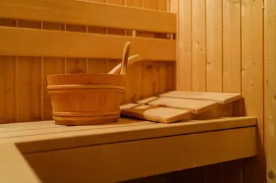 a sauna with a wooden cup and a cutting board at Hotel Ego - Free Parking - Top Central Location in Plovdiv