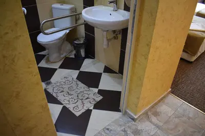 a bathroom with a sink and a toilet at Slavyanska Beseda Hotel in Sofia