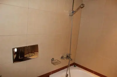 a shower in a bathroom with a bath tub at PM Services Royal Plaza Apartments in Borovets