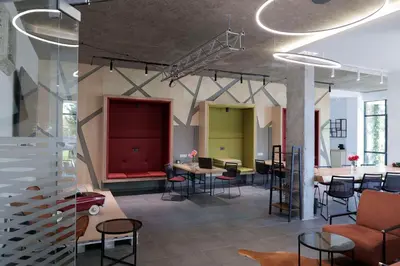 a room with tables and chairs in a building at Local Stay Hotel, BW Signature Collection in Bansko