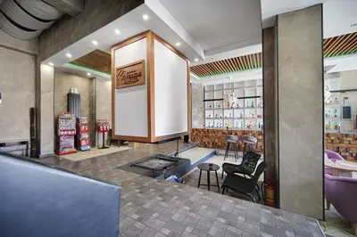 a restaurant with a bar with chairs and tables at Riverside Boutique Hotel in Bansko