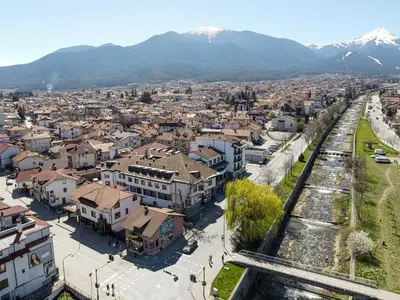 an aerial view of a city with mountains in the background at Riverside Boutique Hotel in Bansko