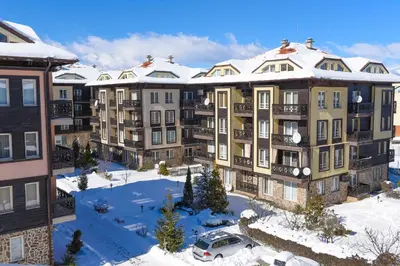 an aerial view of an apartment complex in the snow at Hotel Bojur & Bojurland Apartment Complex in Bansko