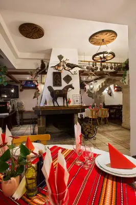 a dining room with a table with a red table cloth at Victoria Hotel Borovets - Free Parking in Borovets