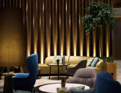 a living room with a couch and chairs and a table at Hilton Sofia in Sofia