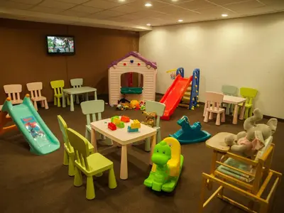 a room with many different kinds of play equipment at Green Life Family Apartments Pamporovo in Pamporovo