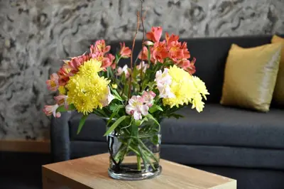 a vase of flowers sitting on a table at Budapest Hotel - Free Parking in Sofia