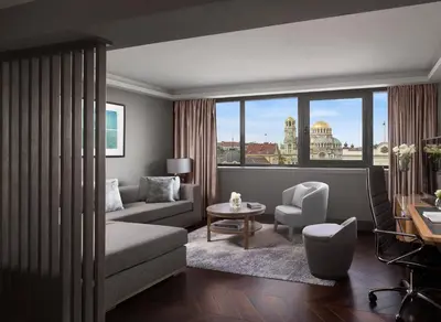 a living room with a couch and a chair at InterContinental Sofia by IHG in Sofia